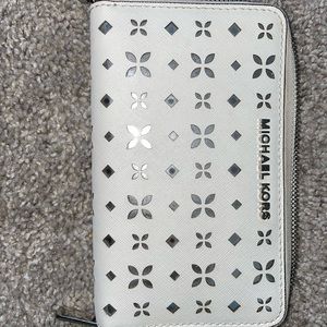 Used has staining around zipper